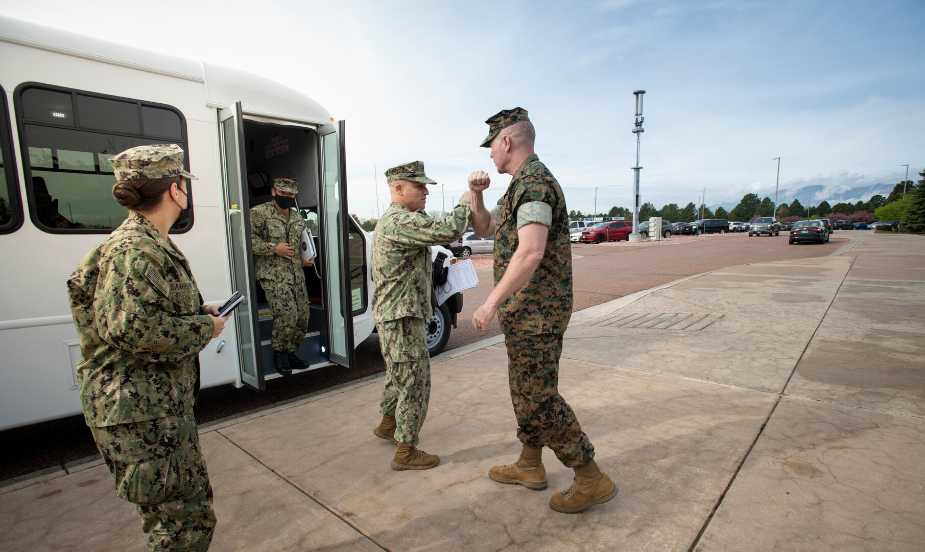 military official greet each other
