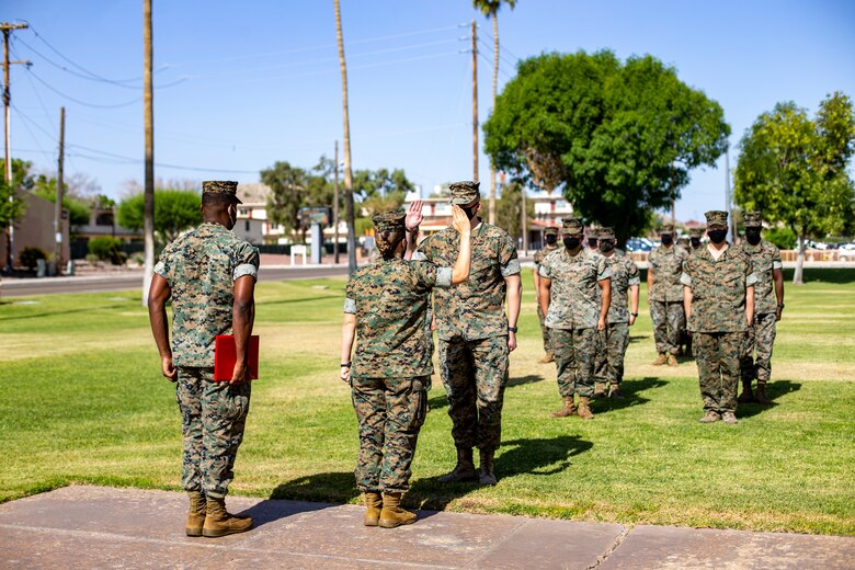 U.S. Marine Corps Cpl. Skylar Jacobson, an administration specialist with Headquarters and Headquarters Squadron (H&HS), re-enlists during a ceremony aboard Marine Corps Air Station Yuma on May 14, 2021. This is Cpl Jacobson's first reenlistment into the Marine Corps. (U.S. Marine Corps photo by Lance Cpl Gabrielle Sanders)