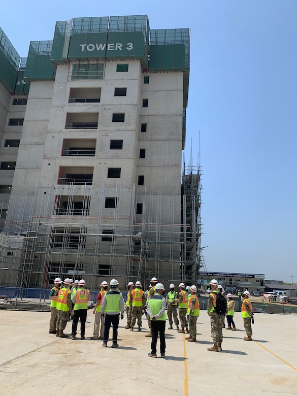 Far East District project site personnel give 11th Engineer Battalion Soldiers a tour of the USAG Humphreys construction site, AFH100, during a visit, May 13