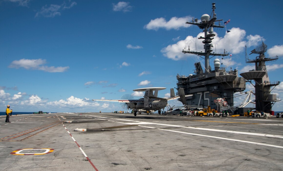 An E-2D Hawkeye, assigned to the "Seahawks" of Carrier Airborne Early Warning Squadron (VAW) 126, lands on the flight deck of the Nimitz-class aircraft carrier USS Harry S. Truman (CVN 75) during carrier qualifications after completing an extended incremental availability.