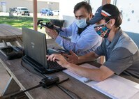 Julio Toala, Air Force Civil Engineer Center GeoBase program geospatial operations manager, receives training from Joseph Campbell, Emerging Technologies Institute chief technology officer and lead instructor, on drone pre-flight checks at San Geronimo Air Park, Texas, May 7, 2021. The training focused on pre- and post-flight checks, projecting flight patterns and 3D mapping using images from the drone. The Air Force GeoBase mission is to create and exploit geospatial information and services to optimize agile combat support and minimize operational risk.