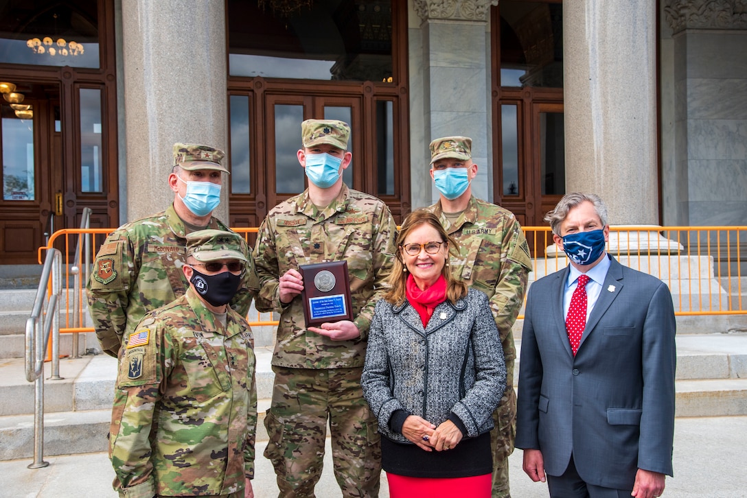 Maj. Gen. Francis Evon, adjutant general for the Connecticut National Guard, front left, and leaders of the Guard's Joint Cyber Response Team with Connecticut Secretary of State Denise Merrill and Deputy Secretary of State Scott Bates after the team received the National Association of Secretaries of State Medallion Award May 12, 2021, for fortifying cybersecurity ahead of the 2020 presidential election.