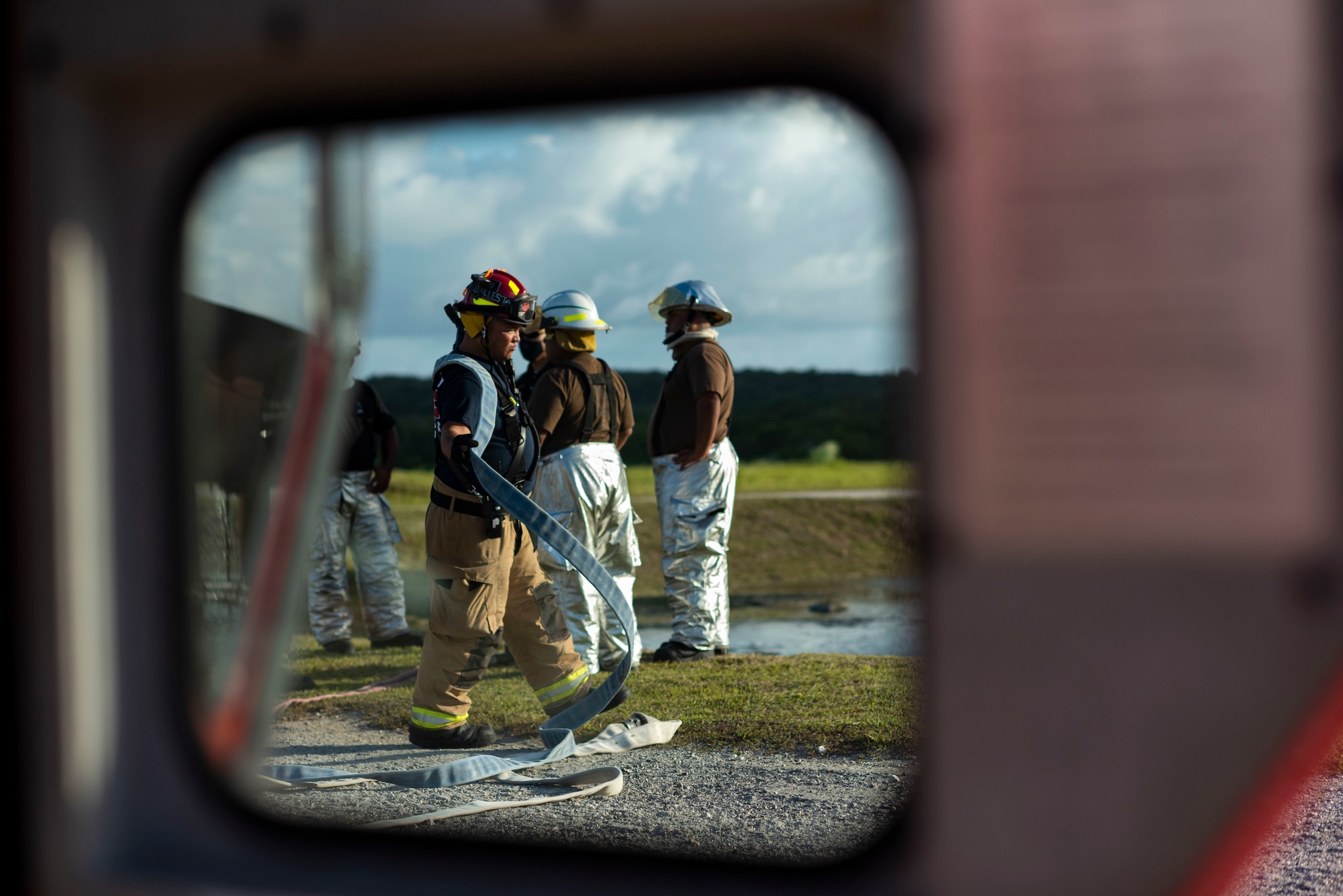 U.S. Air Force and Palau firefighters put out a simulated aircraft fire during joint aircraft fire training at Andersen Air Force Base, Guam, May 11, 2021.