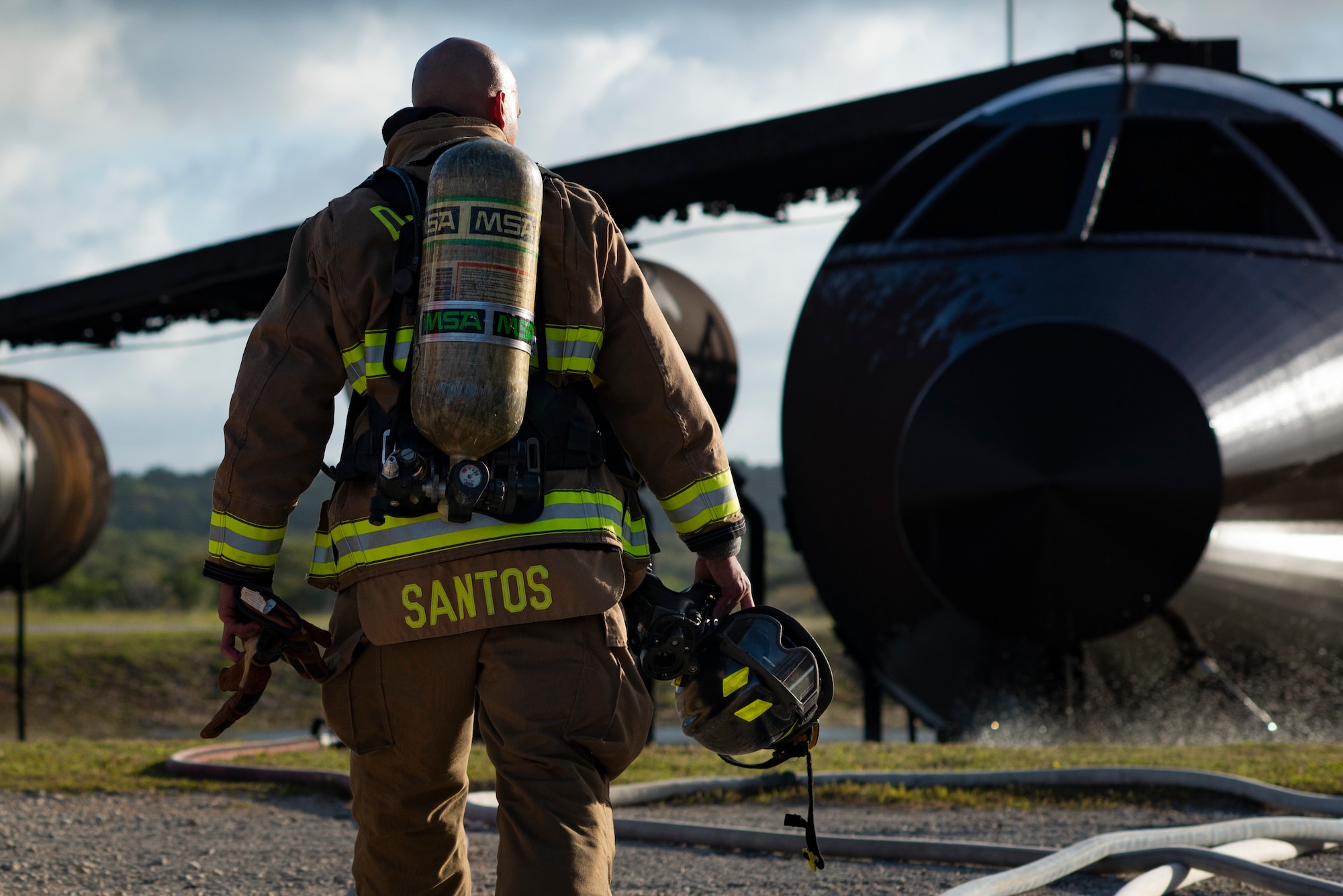 Rusty Santos, firefighter assigned to the 36th Civil Engineer Squadron, gears up for a joint live fire training at Andersen Air Force Base, Guam, May 11, 2021.