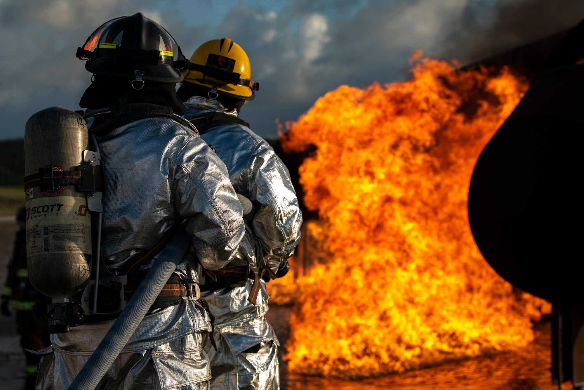 Palau firefighters put out a simulated aircraft fire during joint aircraft fire training at Andersen Air Force Base, Guam, May 11, 2021.