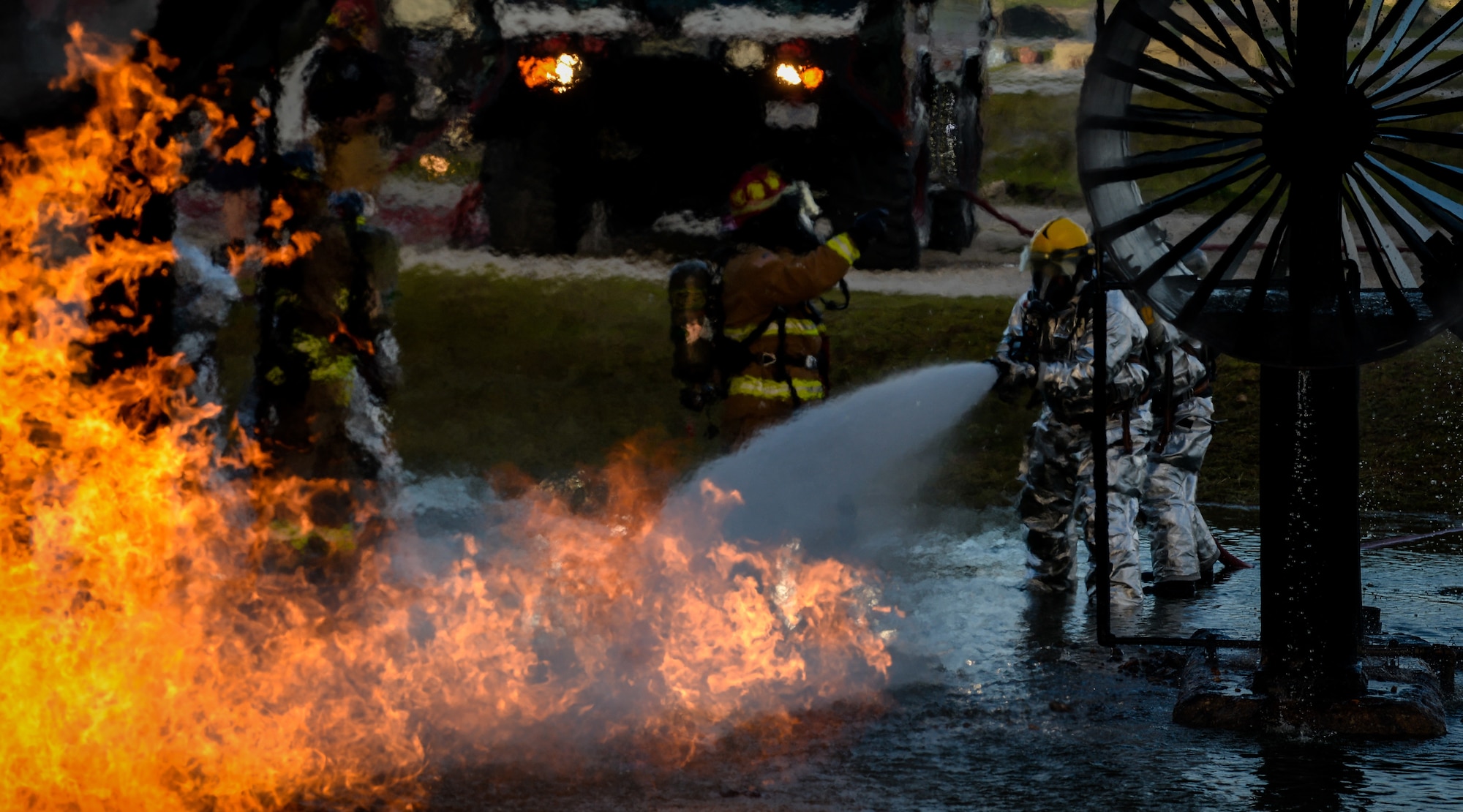 U.S. Air Force and Palau firefighters put out a simulated aircraft fire during joint aircraft fire training at Andersen Air Force Base, Guam, May 11, 2021.