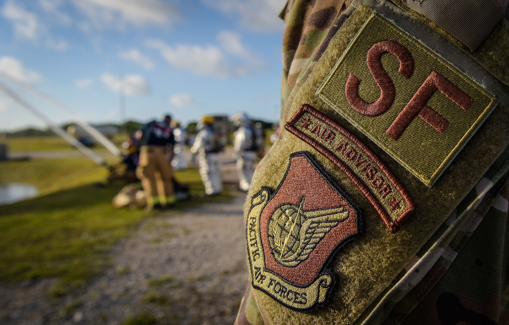 U.S. Air Force Master Sgt. Anthony Nixon, air advisor assigned to the 36th Contingency Response Support Squadron, observes firefighters during joint aircraft fire training at Andersen Air Force Base, Guam, May 11, 2021.