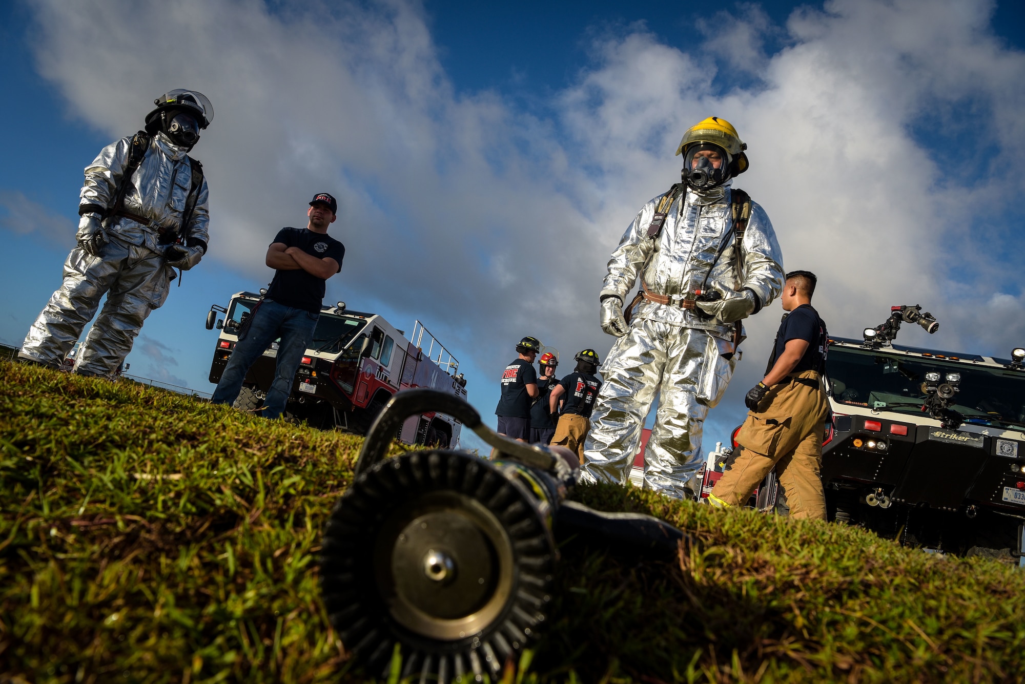 U.S. Air Force and Palau firefighters prepare fire hoses during joint aircraft fire training at Andersen Air Force Base, Guam, May 11, 2021.