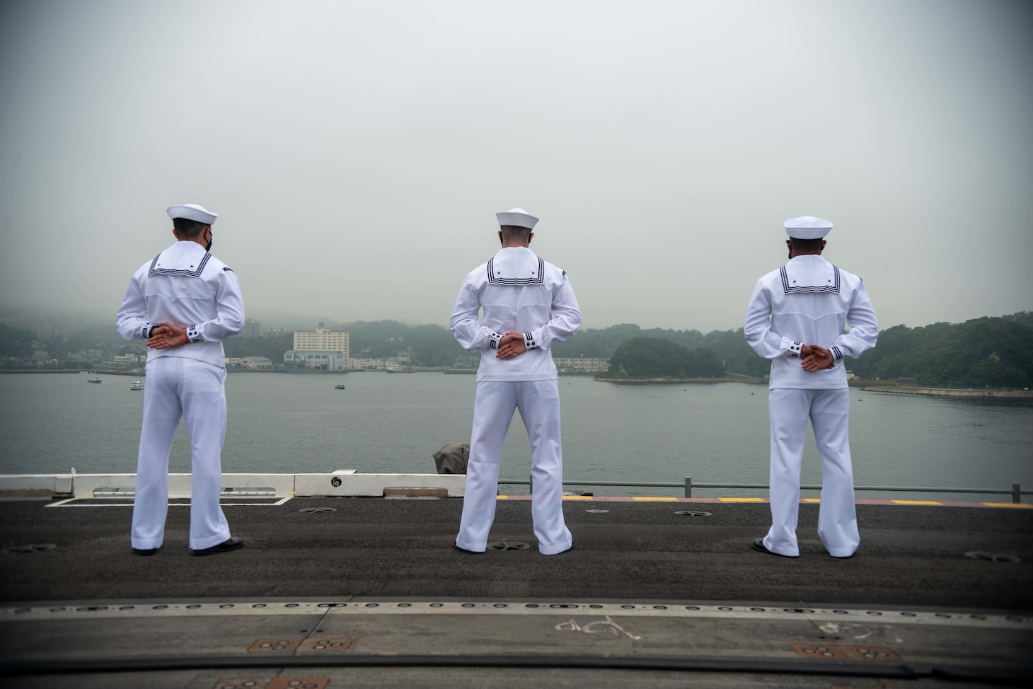 210519-N-LI114-1077 YOKOSUKA, Japan (May 19, 2021) Sailors man the rails on the flight deck of the U.S. Navy’s only forward-deployed aircraft carrier USS Ronald Reagan (CVN 76) as it departs Commander, Fleet Activities Yokosuka, Japan. Ronald Reagan, the flagship of Carrier Strike Group Five, provides a combat-ready force that protects and defends the United States, as well as the Collective maritime interests of its allies and partners in the Indo-Pacific region. (U.S. Navy Photo by Mass Communication Specialist 3rd Class Michael B. Jarmiolowski)