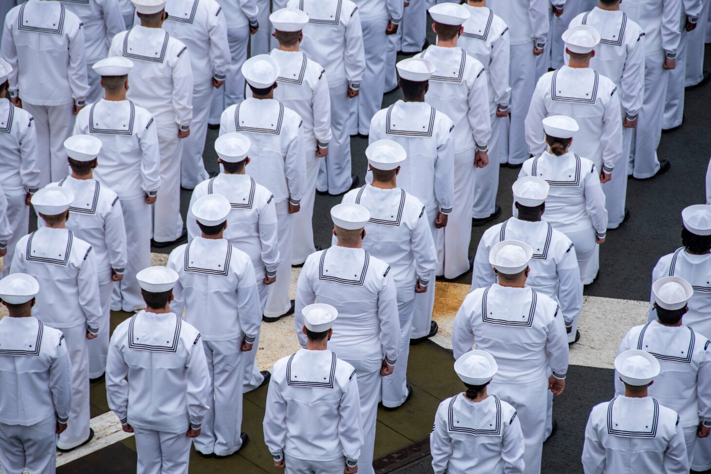 210519-N-WS494-1026 YOKOSUKA, Japan (May 19, 2021) Sailors prepare to man the rails on the flight deck of the U.S. Navy’s only forward-deployed aircraft carrier USS Ronald Reagan (CVN 76) as it departs Commander, Fleet Activities Yokosuka, Japan. Ronald Reagan, the flagship of Carrier Strike Group Five, provides a combat-ready force that protects and defends the United States, as well as the collective maritime interests of its allies and partners in the Indo-Pacific region. (U.S. Navy photo by Mass Communication Specialist 3rd Class Quinton A. Lee)