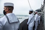 210519-N-WS494-1081 YOKOSUKA, Japan (May 19, 2021) Sailors man the rails on the superstructure of the U.S. Navy’s only forward-deployed aircraft carrier USS Ronald Reagan (CVN 76) as it departs Commander, Fleet Activities Yokosuka, Japan. Ronald Reagan, the flagship of Carrier Strike Group Five, provides a combat-ready force that protects and defends the United States, as well as the collective maritime interests of its allies and partners in the Indo-Pacific region. (U.S. Navy photo by Mass Communication Specialist 3rd Class Quinton A. Lee)