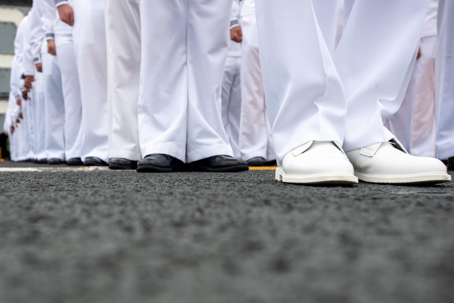 210519-N-WU964-1051 YOKOSUKA, Japan (May 19, 2021) Sailors prepare to man the rails on the flight deck of the U.S. Navy’s only forward-deployed aircraft carrier USS Ronald Reagan (CVN 76) as it departs Commander, Fleet Activities Yokosuka, Japan. Ronald Reagan, the flagship of Carrier Strike Group 5, provides a combat-ready force that protects and defends the United States, as well as the collective maritime interests of its allies and partners in the Indo-Pacific region. (U.S. Navy photo by Mass Communication Specialist Seaman Apprentice Dallas Snider)