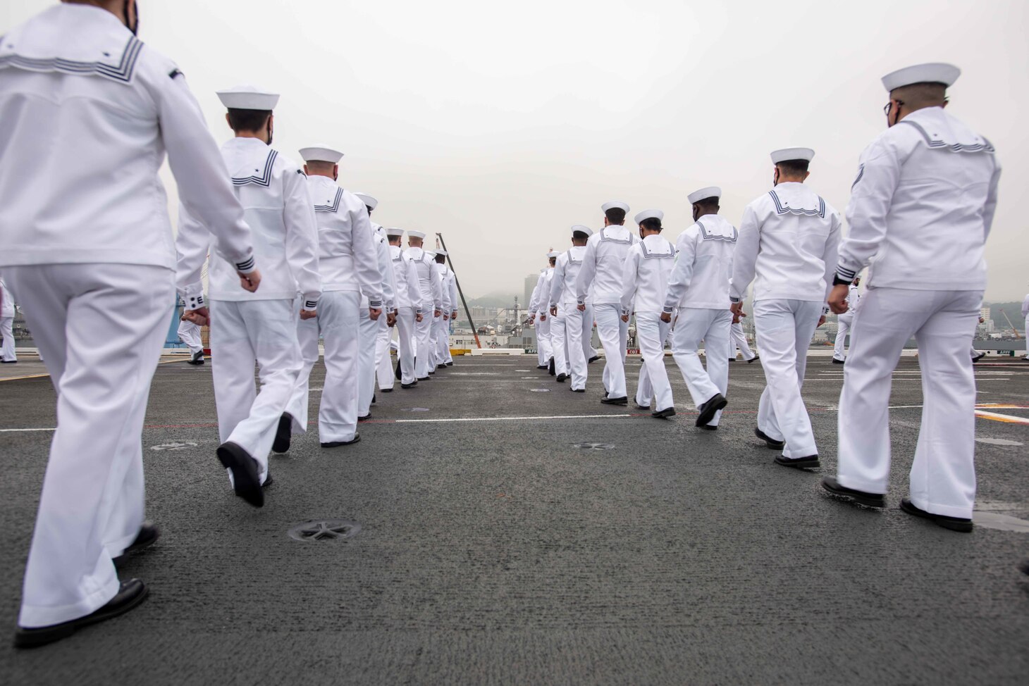 210519-N-WU964-1092 YOKOSUKA, Japan (May 19, 2021) Sailors man the rails on the flight deck of the U.S. Navy’s only forward-deployed aircraft carrier USS Ronald Reagan (CVN 76) as it departs Commander, Fleet Activities Yokosuka, Japan. Ronald Reagan, the flagship of Carrier Strike Group 5, provides a combat-ready force that protects and defends the United States, as well as the collective maritime interests of its allies and partners in the Indo-Pacific region. (U.S. Navy photo by Mass Communication Specialist Seaman Apprentice Dallas Snider)