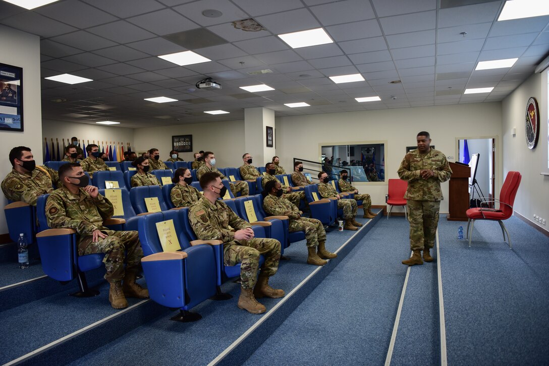 Chief Master Sgt. Phillip Easton, U.S. European Command senior enlisted leader, speaks to Tech. Sgt. Adam K. Ginett Airman Leadership School (ALS) students at Aviano Air Base, Italy, May 13, 2021. During his visit, Easton passed along his 30 years of service leadership philosophies to the newest graduating ALS class. Easton discussed guiding new troops in a nurturing manner with humbleness, approachability and credibility. (U.S. Air Force photo by Senior Airman Jessica Blair)