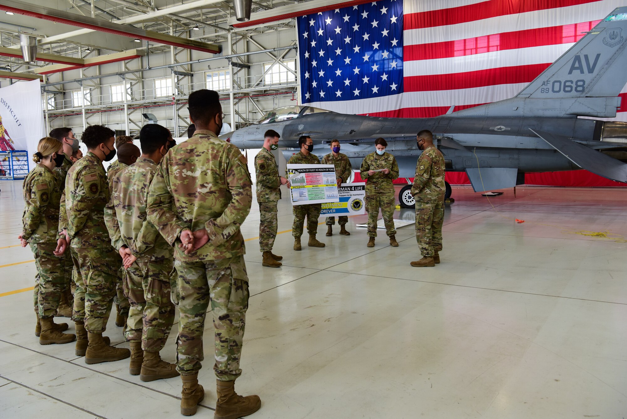 Chief Master Sgt. Phillip Easton, U.S. European Command senior enlisted leader, speaks to Airmen from the 31st Maintenance Squadron to discuss the “Airmen 4 Life” program at Aviano Air Base, Italy, May 13, 2021. During his visit to the base Easton spoke with Airmen about the “Airmen 4 Life” program and how beneficial it is for their daily lives. (U.S. Air Force photo by Senior Airman Jessica Blair)
