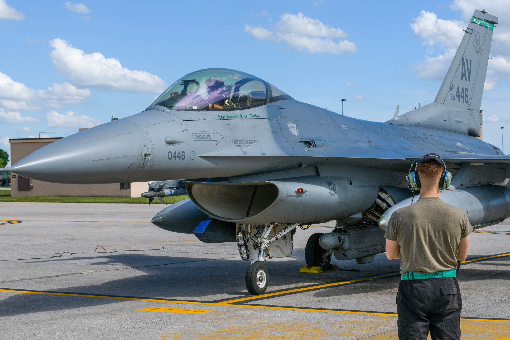 Senior Airman Neil Farbotnik, 555th Aircraft Maintenance Unit F-16 Fighting Falcon crew chief, marshals in an F-16 participating in Astral Knight 2021 (AK21) at Aviano Air Base, Italy, May 18, 2021. Eight F-16s assigned to the 555th Fighter Squadron are participating in AK21, which is a joint, multinational exercise designed to test integrated air and missile defense capabilities. AK21 aims to demonstrate the integration, coordination and interoperability of joint existing command and control. (U.S. Air Force photo by Airman 1st Class Brooke Moeder)