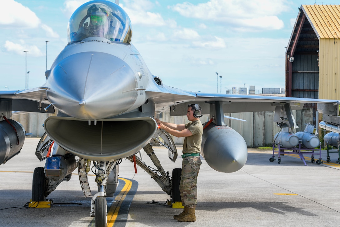 Senior Airman Juan Monroy, 555th Aircraft Maintenance Unit F-16 Fighting Falcon crew chief, provides post-flight operations on an F-16 participating in Astral Knight 2021 (AK21) at Aviano Air Base, Italy, May 18, 2021. Eight F-16s assigned to the 555th Fighter Squadron are participating in AK21, which is a joint, multinational exercise designed to test integrated air and missile defense capabilities. AK21 involves approximately 1900 combined joint force members from the Albanian, Croatian, Hellenic, Italian and Slovenian militaries. (U.S. Air Force photo by Airman 1st Class Brooke Moeder)