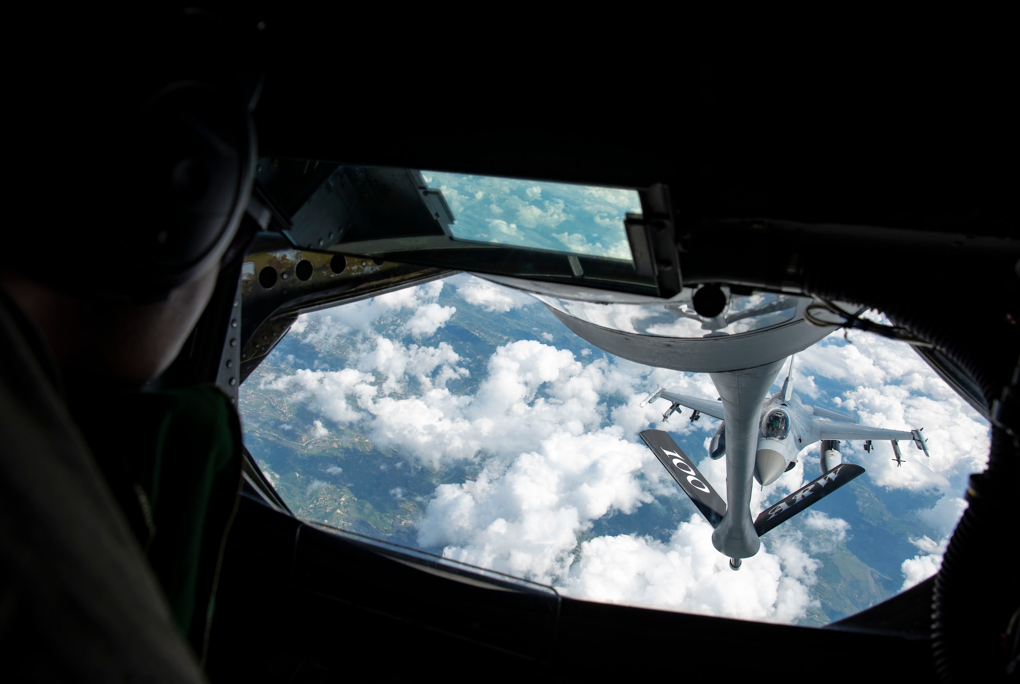 U.S. Air Force Senior Airman Anthony Toliver, 351st Air Refueling Squadron, boom Operator, refuels a U.S Air Force F-16C Fighting Falcon aircraft assigned to the 555th Fighter Squadron, Aviano Air Base, Italy, during exercise Astral Knight 21 over Italy, May 18, 2021.