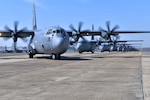Nineteen C-130J aircraft take part in an elephant walk before takeoff during an exercise March 15, 2018, at Little Rock Air Force Base, Ark. Numerous C-130J units from around the Air Force participated in a training event to enhance operational effectiveness and joint interoperability.