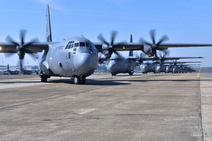 Nineteen C-130J aircraft take part in an elephant walk before takeoff during an exercise March 15, 2018, at Little Rock Air Force Base, Ark. Numerous C-130J units from around the Air Force participated in a training event to enhance operational effectiveness and joint interoperability.