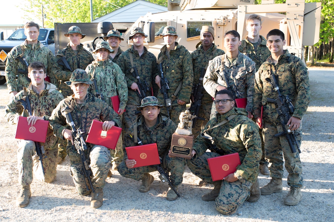 Marine Corps Security Force Regiment hosted the 1st Annual MCSFR Squad Competition at Fort Pickett in Blackstone, Virginia, April 24-30, 2021. Marines and Sailors from across the regiment competed against each other in a rigorous training event focused on the infantry skills of each squad. Col. Corey Collier, the commanding officer of MCSFR, awarded Marines and Sailors with Navy and Marine Corps Achievement Medals (NAMs) for excelling in their duties and contributing to the success of the first annual MCSFR Squad Competition. The winning squad from Marine Corps Security Force Battalion - Bangor, Washington, was awarded a trophy to take home until next year. (U.S. Marine Corps Photos by Sgt. Danielle Prentice)