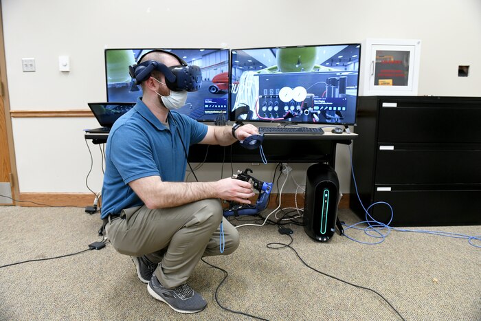 man adjusting computer