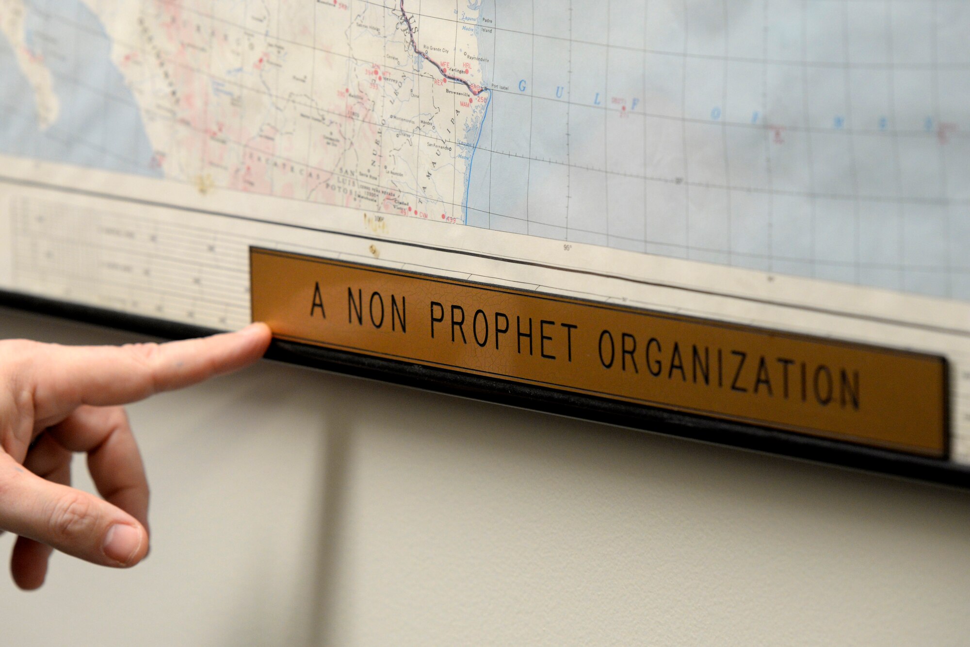 A placard inside the 88th Operations Support Squadron Base Weather Station at Wright-Patterson Air Force Base, Ohio on March 2, 2021. The weather station operates with ten contactors, around the clock and supports the aviation mission through briefs, observations and forecasts, and the resource protection mission through watches, warnings and advisories. (U.S. Air Force photo by Ty Greenlees)