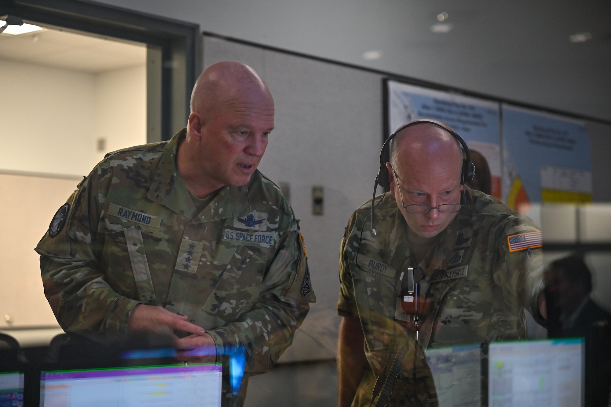 U.S. Space Force Gen. John W. "Jay" Raymond, left, Chief of Space Operations, speaks with Brig. Gen. Stephen Purdy, Space Launch Delta 45 commander, at Cape Canaveral Space Force Station, Fla., May 17, 2021. During his visit, Raymond toured several facilities at CCSFS and met with Airmen and Guardians supporting space launch operations. (U.S. Space Force photo by Airman 1st Class Thomas Sjoberg)