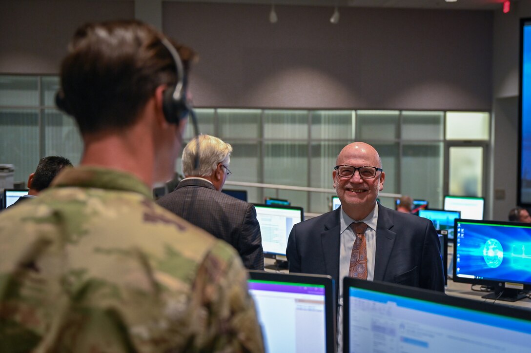 Acting Secretary of the Air Force John P. Roth, speaks with U.S. Air Force 1st Lt. Nicholas Francoeur, 1st Range Operations Squadron range operations commander, at Cape Canaveral Space Force Station, Fla., May 17, 2021. During his visit, Roth toured several facilities at CCSFS and met with Airmen and Guardians supporting space launch operations. (U.S. Space Force photo by Airman 1st Class Thomas Sjoberg)
