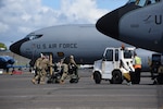 Airmen from the Iowa Air National Guard’s 185th Air Refueling Wing move a fuel system icing inhibitor cart in place to begin refueling a U.S. Air Force KC-135 on the flight line at the Glasgow Prestwick International Airport, Scotland, May 18, 2021. The portable fuel injection system is used to add deicing fuel additive during ground refueling. Air Guard Airmen and their refueling aircraft are in Scotland providing air refueling support as part of NATO exercise Formidable Shield.