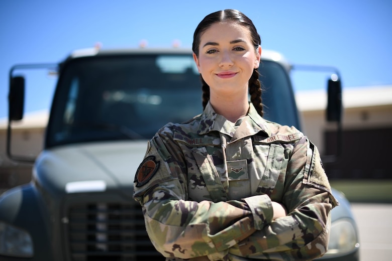 Airman Angela Hall, 22nd Logistics Readiness Squadron fuels distribution apprentice, poses for a photo April 29, 2021, at McConnell Air Force Base, Kansas. On her way to the airport, Hall had acted without hesitation and was able to save an elderly couple from their smoking car after it crashed into a light pole.  (U.S. Air Force photo by Senior Airman Nilsa Garcia)