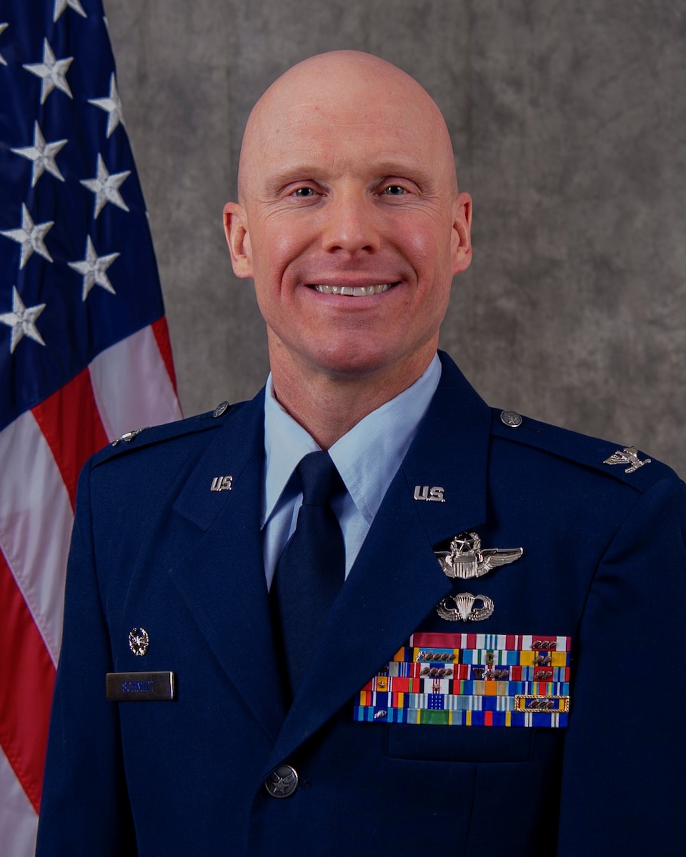 Official Air Force biography photo for Col. Eric Schmidt. looking at the camera in Air Force blues uniform.