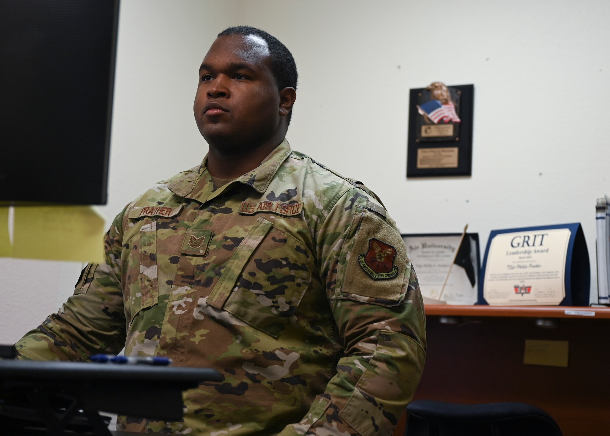 Tech. Sgt. Phillip E. Prather Jr. works at his desk.