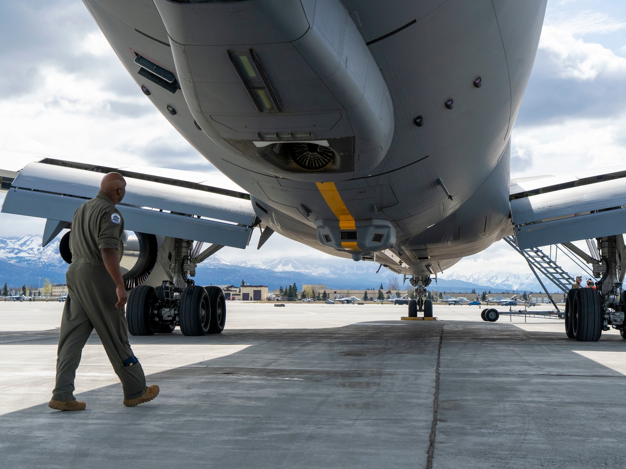 U.S. Air Force Maj. Will Watson, a pilot assigned to the 905th Air Refueling Squadron from McConnell Air Force Base, Kan., conducts a pre-flight check on a KC-46A Pegasus aircraft, assigned to the 931st Air Refueling Wing, prior to take off from Joint Base Elmendorf-Richardson, Alaska, May 11, 2021, in support of exercise Northern Edge 2021.  Approximately 15,000 U.S. service members are participating in a joint training exercise hosted by U.S. Pacific Air Forces May 3-14, 2021, on and above the Joint Pacific Alaska Range Complex, the Gulf of Alaska, and temporary maritime activities area. NE21 is one in a series of U.S. Indo-Pacific Command exercises designed to sharpen the joint forces’ skills; to practice tactics, techniques, and procedures; to improve command, control and communication relationships; and to develop cooperative plans and programs. (U.S. Air Force photo by Senior Airman Adriana Barrientos)
