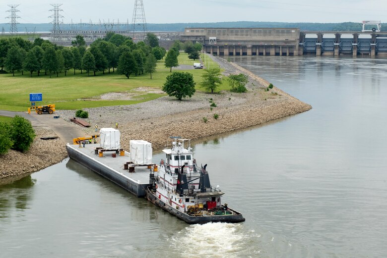 The Motor Vessel John Wepfer delivers two 90-ton transformers May 18, 2021 to the Barkley Dam Powerplant on the Cumberland River in Kuttawa, Kentucky. The U.S. Army Corps of Engineers Nashville District is replacing the transformers in the switchyard that have been in service since 1971. (USACE Photo by Lee Roberts)