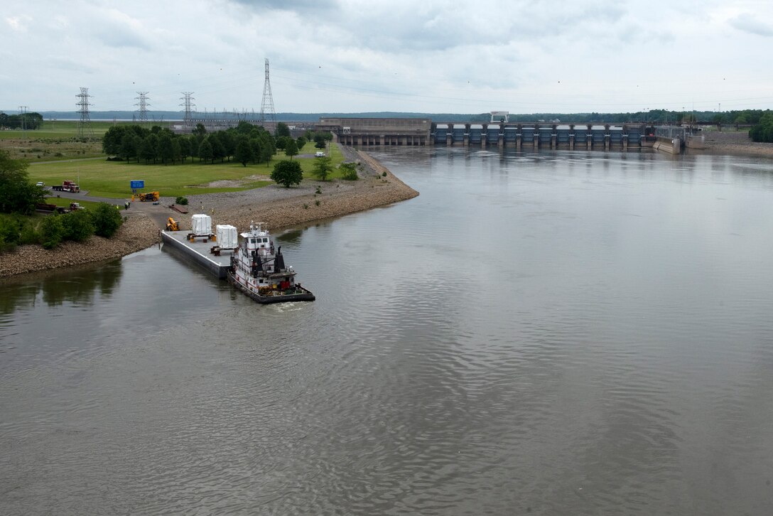 The Motor Vessel John Wepfer delivers two 90-ton transformers May 18, 2021 to the Barkley Dam Powerplant on the Cumberland River in Kuttawa, Kentucky. The U.S. Army Corps of Engineers Nashville District is replacing the transformers in the switchyard that have been in service since 1971. (USACE Photo by Lee Roberts)