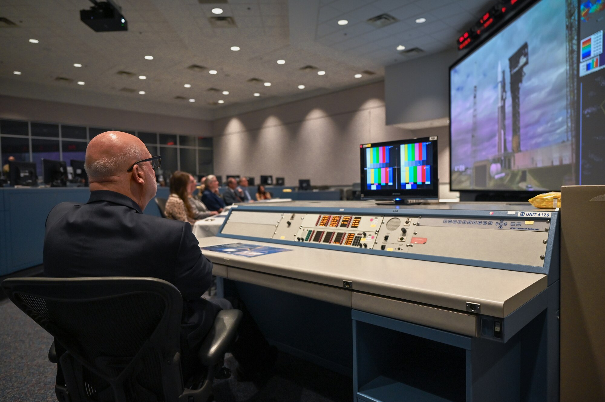 Acting Secretary of the Air Force John P. Roth, listens to a presentation in the Morrell Operations Center at Cape Canaveral Space Force Station, Fla., May 17, 2021. During his visit, Roth toured several facilities at CCSFS and met with Airmen and Guardians supporting space launch operations. (U.S. Space Force photo by Airman 1st Class Thomas Sjoberg)