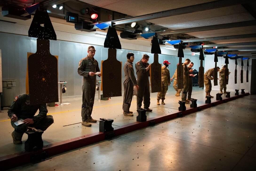 Participants of the 2021 National Police Week Excellence in Competition pistol challenge review and score their partner’s targets at Ellsworth Air Force Base, S.D., May 12, 2021.
