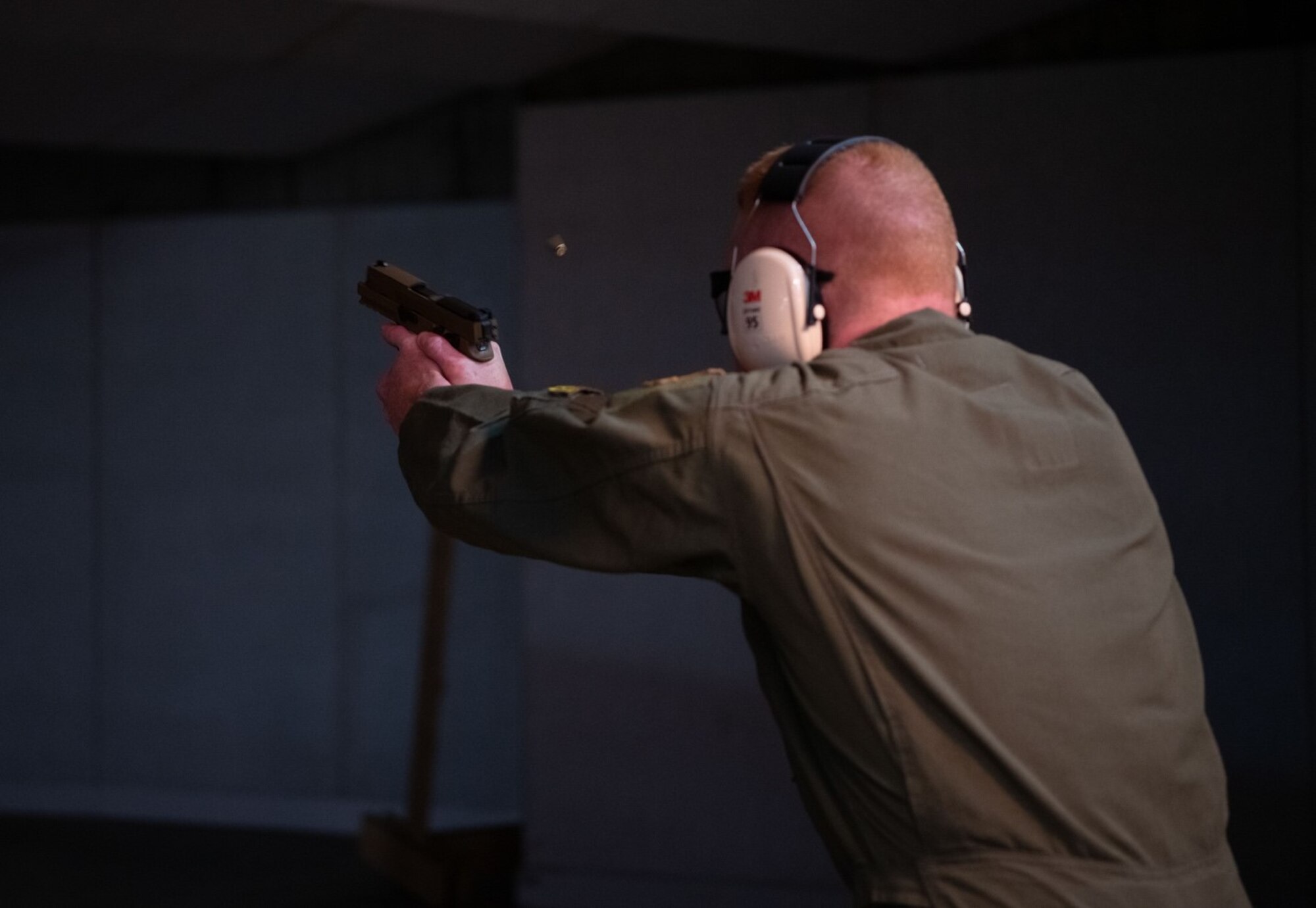 Capt. Kyle Byrd, a 37th Bomb Squadron pilot, fires an M-18 pistol during the National Police Week Excellence in Competition challenge at Ellsworth Air Force Base, S.D., May 12, 2021.