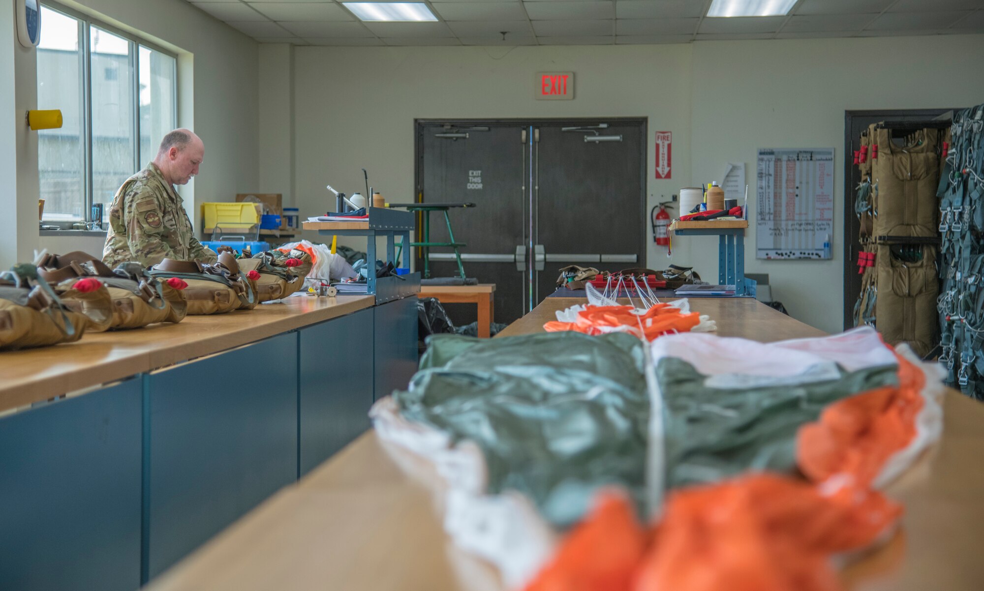 Tech. Sgt. Ronald Patton, 403rd Operations Squadron aircrew flight equipment technician at Keesler Air Force Base, Miss., works on a Butler Parachutes BA-30 Low Profile Parachute system April 29, 2021. The BA-30 is new to the the two flying squadrons the 403rd OSS supports, replacing the BA-22. (U.S. Air Force photo by Staff Sgt. Kristen Pittman)