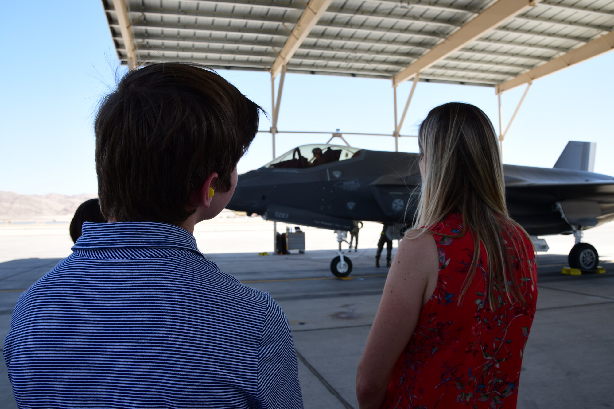 Col. Sean Carpenter's, 926th Wing commander, family waits to greet him as he finishes his final flight as wing commander, May 13, at Nellis Air Force Base, Nev. (U.S. Air Force photo by Natalie Stanley)