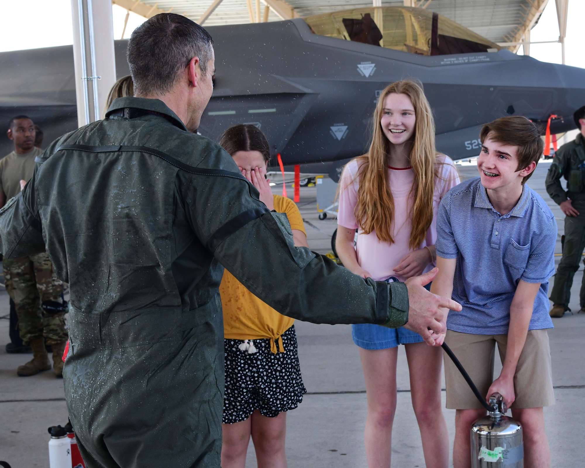 Col. Sean Carpenter, 926th Wing commander, greets his family following his final flight as wing commander, May 13, at Nellis Air Force Base, Nev. (U.S. Air Force photo by Natalie Stanley)