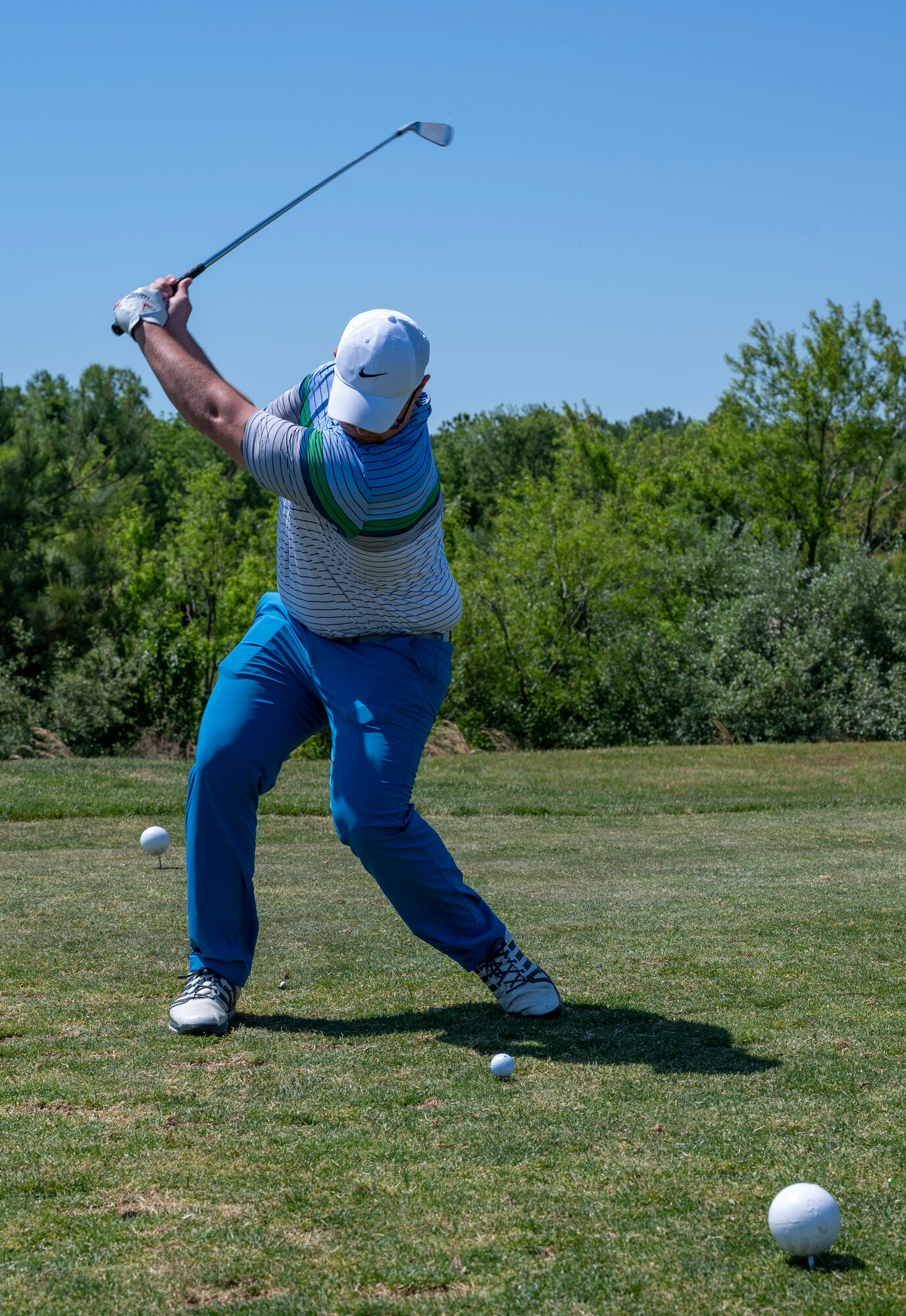 Staff Sgt. Michael Staley, 436th Aircraft Maintenance Squadron assistant flying crew chief, tees off during the annual Bluesuiters Golf Tournament at Jonathan’s Landing Golf Course, Magnolia, Delaware, May 19, 2021. Twice a year, the tournament sponsors Airmen, matching them with local Chamber of Commerce members. This year, 33 Airmen participated for an opportunity to engage in team building activities and network. (U.S. Air Force photo by Airman 1st Class Cydney Lee)
