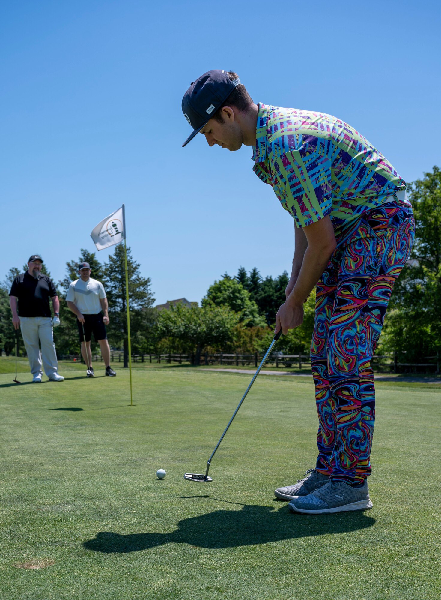 Staff Sgt. Morgen Sindelar, 3rd Airlift Squadron loadmaster, putts a golf ball during the annual Bluesuiters Golf Tournament at Jonathan’s Landing Golf Course, Dover, Delaware, May 19, 2021. Twice a year, the tournament sponsors Airmen, matching them with local Chamber of Commerce members. This year, 33 Airmen participated for an opportunity to engage in team building activities and network. (U.S. Air Force photo by Airman 1st Class Cydney Lee)