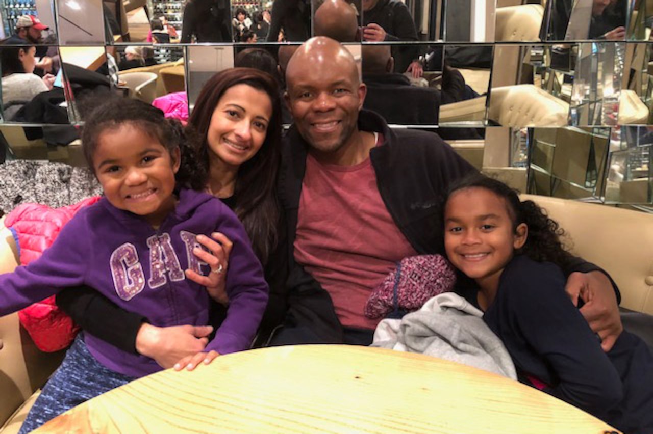 A family poses for a photo.