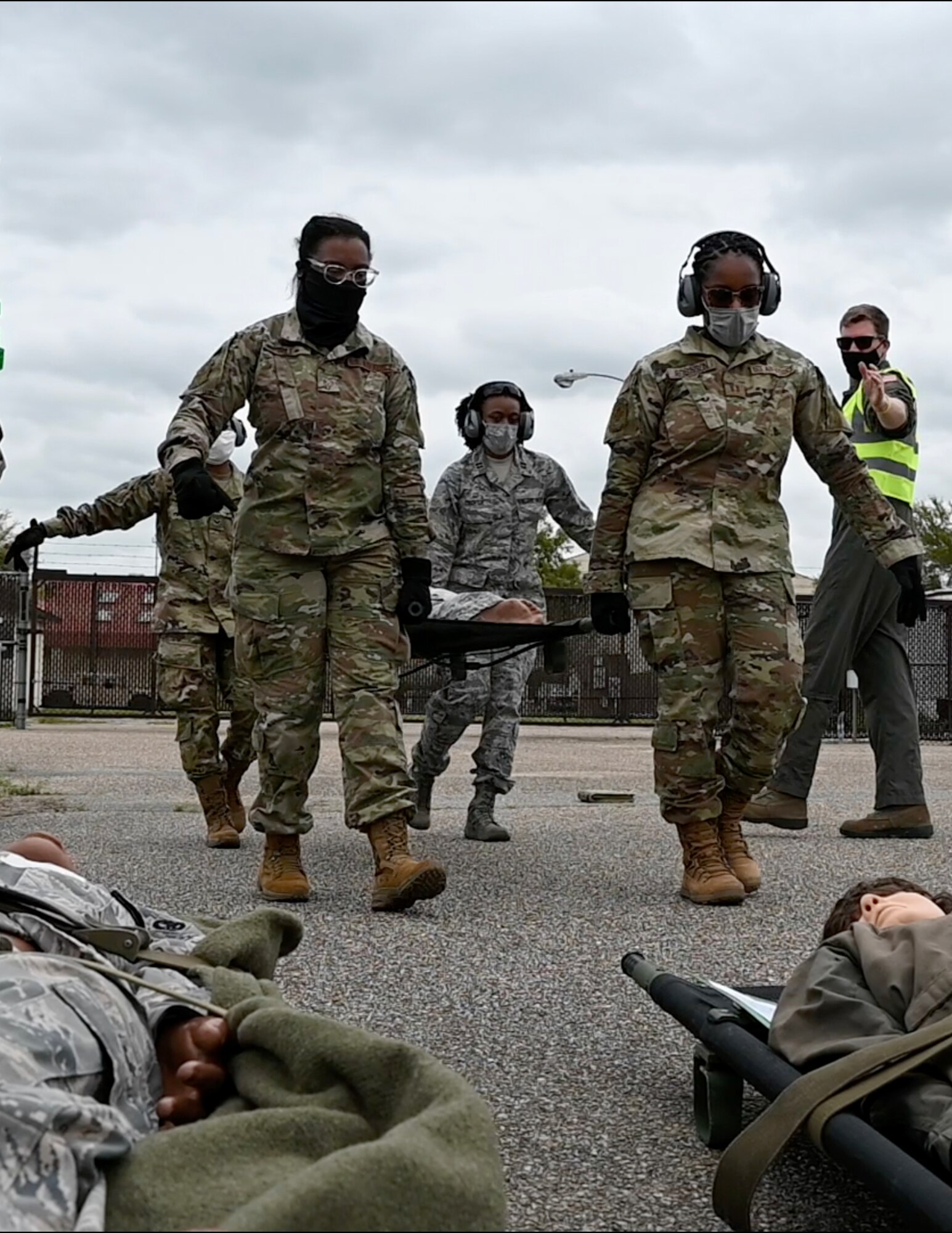 people carrying a patient on a stretcher