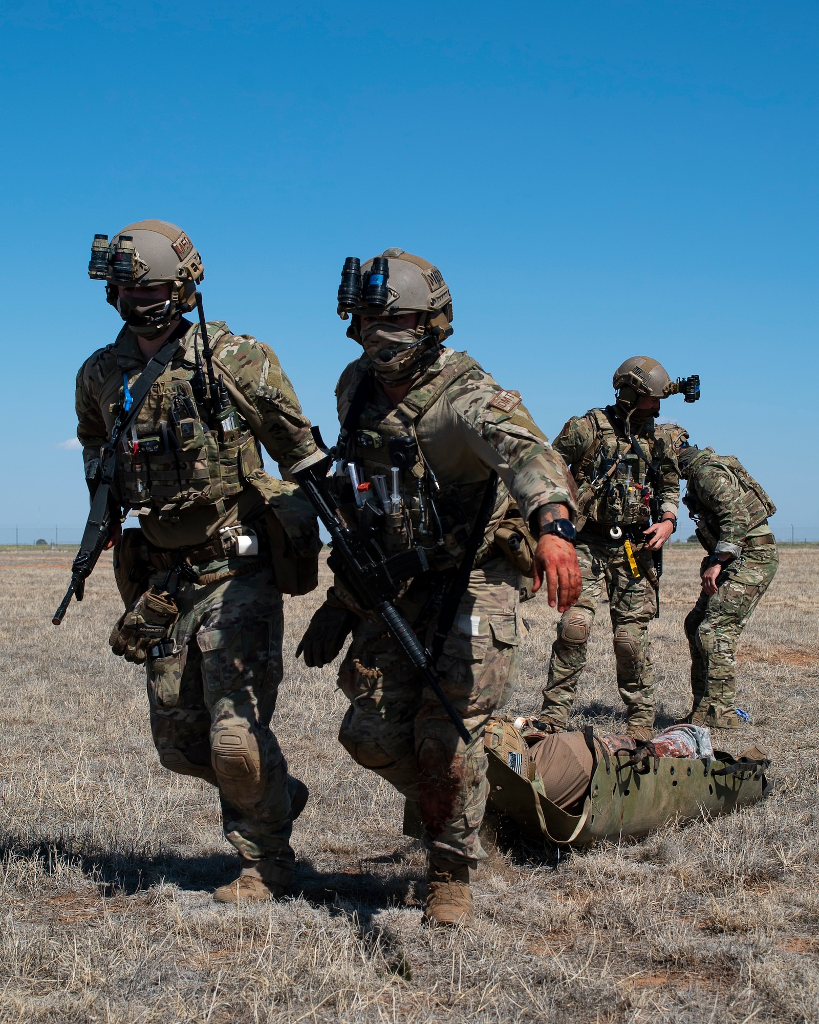 27th Special Operations Support Squadron independent duty medical technicians drag a casualty out of enemy territory during casualty evacuation training at Cannon AFB, N.M., May 7, 2021. CASEVAC training was previously offered solely at Hurlburt Field, Fla., and offering the course at Cannon allows IDMTs to train while preserving resources. (U.S. Air Force photo by Airman 1st Class Christopher Storer)