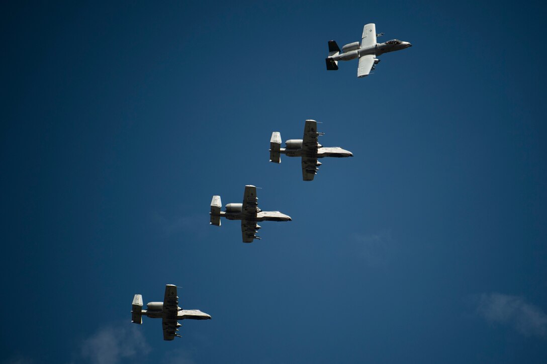photo of four aircraft flying