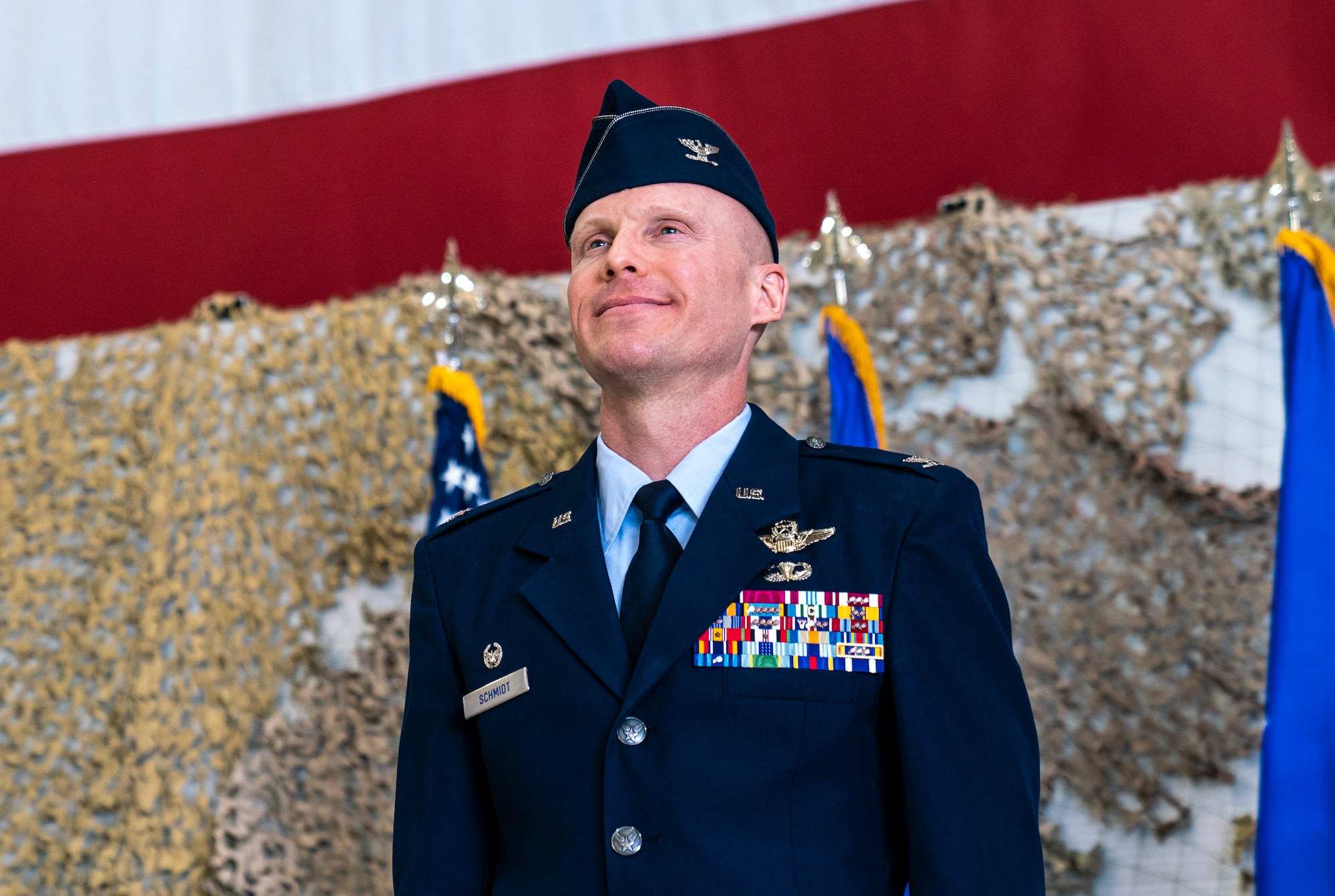 Col. Schmidt smiles after he is announced as the new commander of the 432nd Wing/432nd Air Expeditionary Wing.