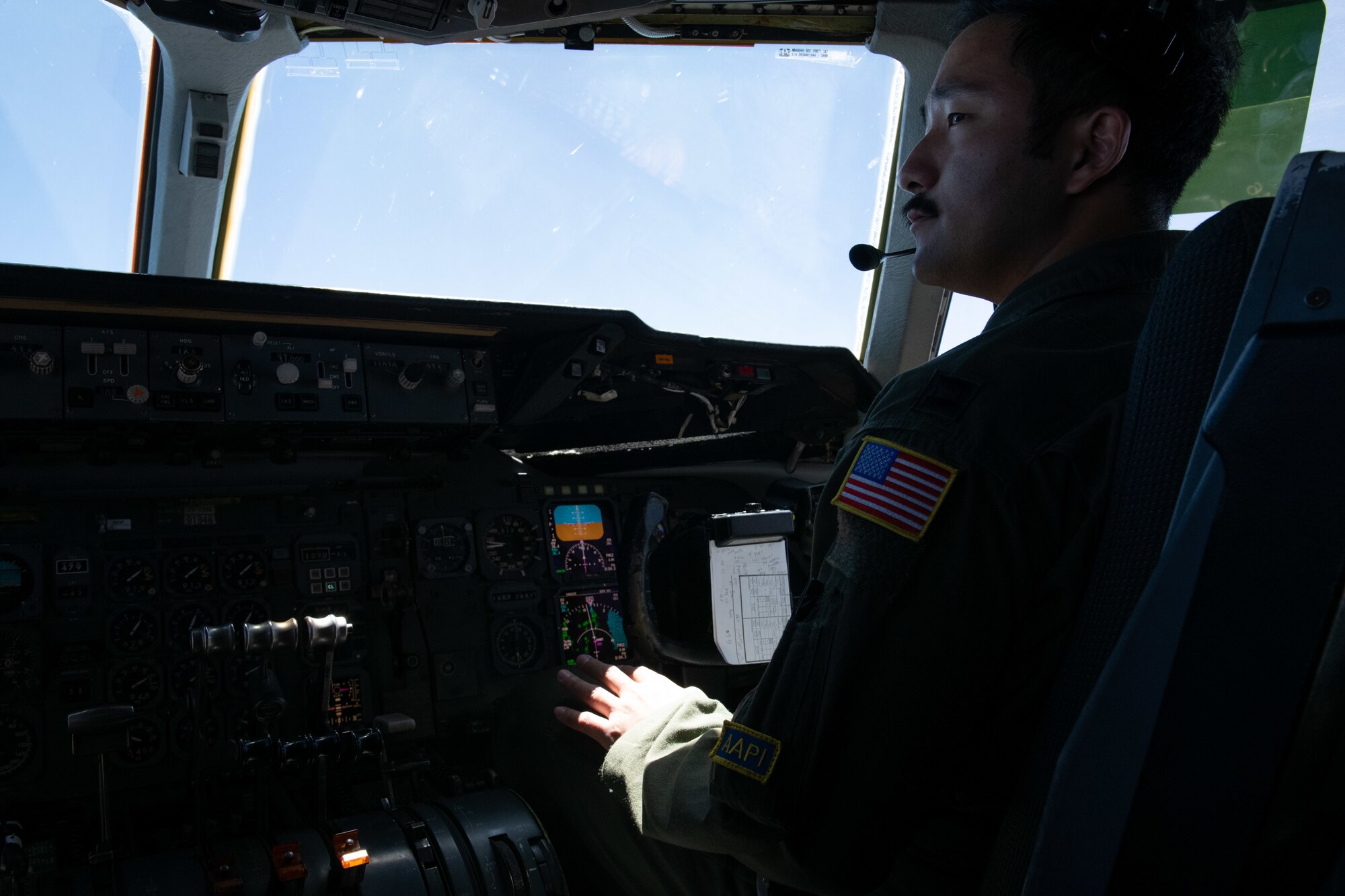 A U.S. Air Force pilot glances to his left while flying a KC-10 en route back to Travis Air Force Base, California, May 16, 2021.
